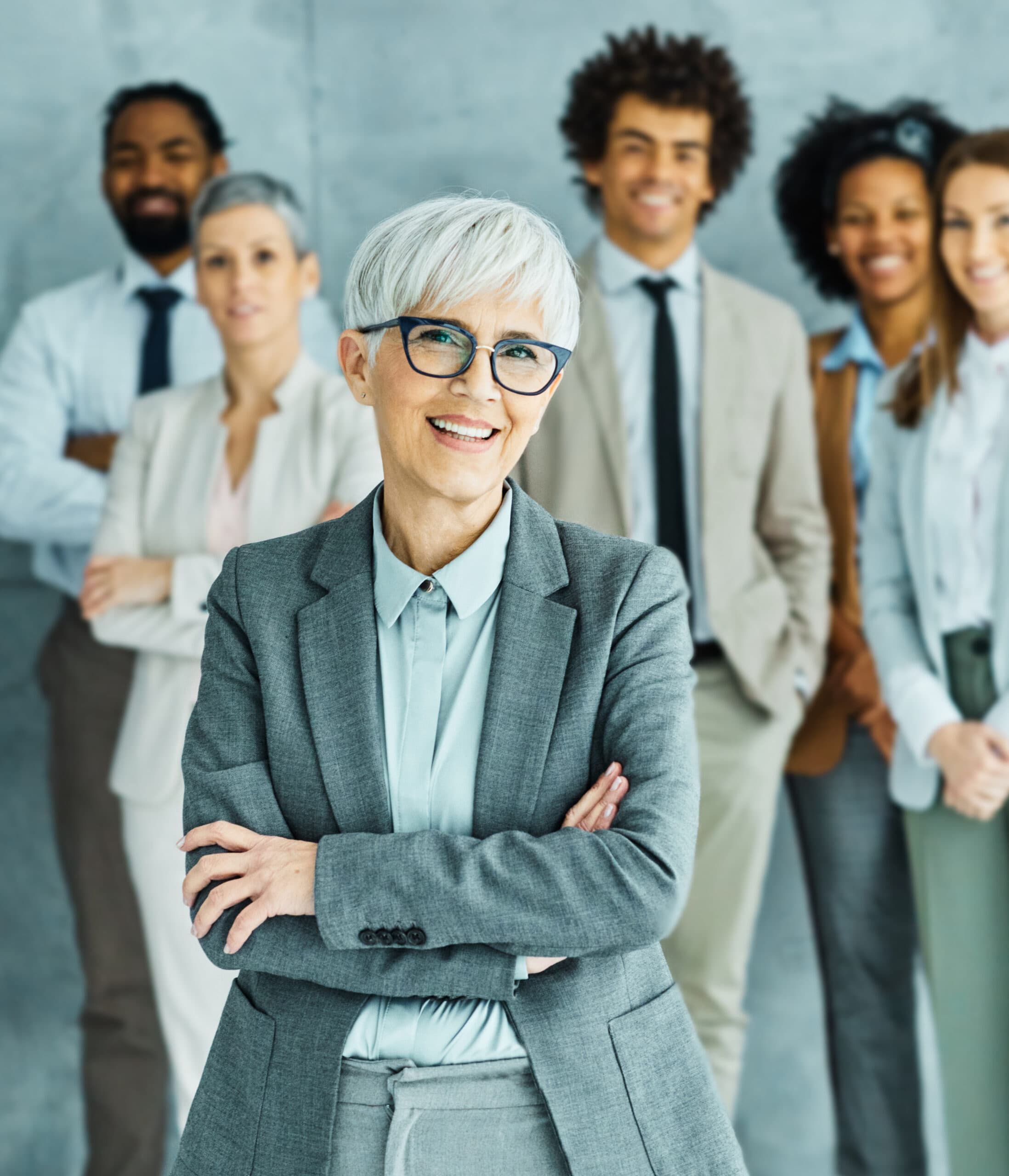 A confident executive leader with her team